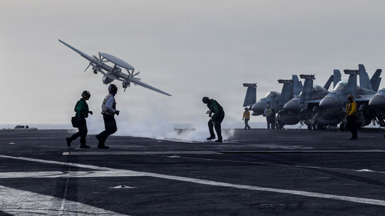 FILE PHOTO: An E-2D Hawkeye surveillance aircraft launches from the flight deck of the U.S. Navy Nimitz-class aircraft carrier USS Abraham Lincoln during thge Operation Epic Fury attack on Iran March 31, 2026. U.S. Navy/Handout via REUTERS/File Photo