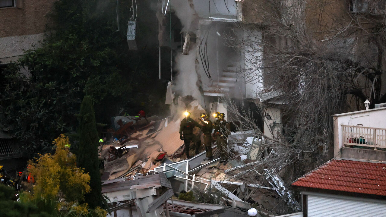 First responders work at the site of a projectile impact, as the U.S.-Israel conflict with Iran continues, in northern Israel, April 5, 2026. REUTERS/Shir Torem