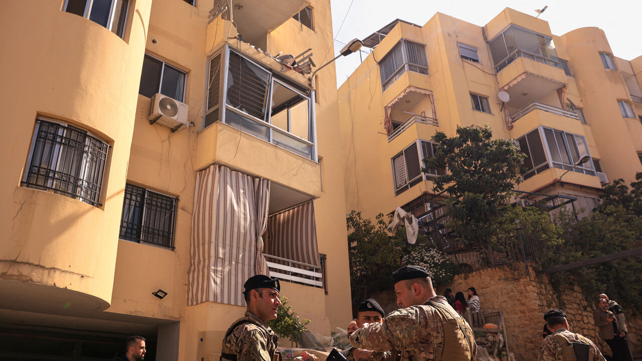 Lebanese Army servicemen stand near an apartment building hit by an Israeli strike amid escalating hostilities between Israel and Hezbollah, as the U.S.-Israel conflict with Iran continues, in Ain Saadeh, Lebanon, April 6, 2026. REUTERS/Raghed Waked