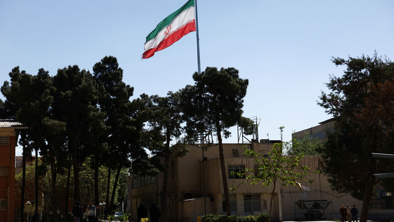 An Iranian flag flies near a building of the Sharif University of Technology, which was damaged in a strike, amid the U.S.-Israeli conflict with Iran, in Tehran, Iran, April 7, 2026. Majid Asgaripour/WANA (West Asia News Agency) via REUTERS