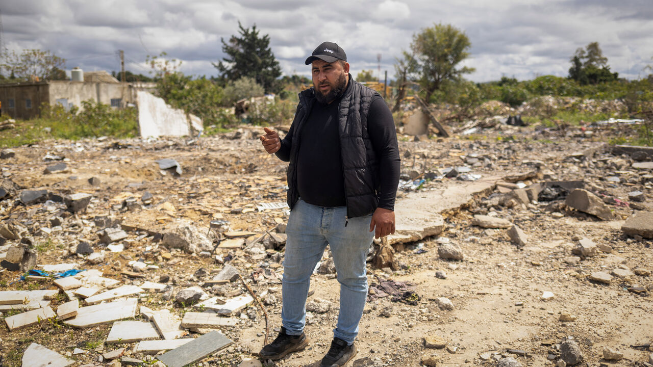 Hussein Saleh, 34, stands on the rubble of his house destroyed in an Israeli airstrike, which killed members of his family, amid escalating hostilities between Israel and Hezbollah, as the U.S.-Israeli conflict with Iran continues, in Tyre, Lebanon, April 7, 2026. REUTERS/Adnan Abidi