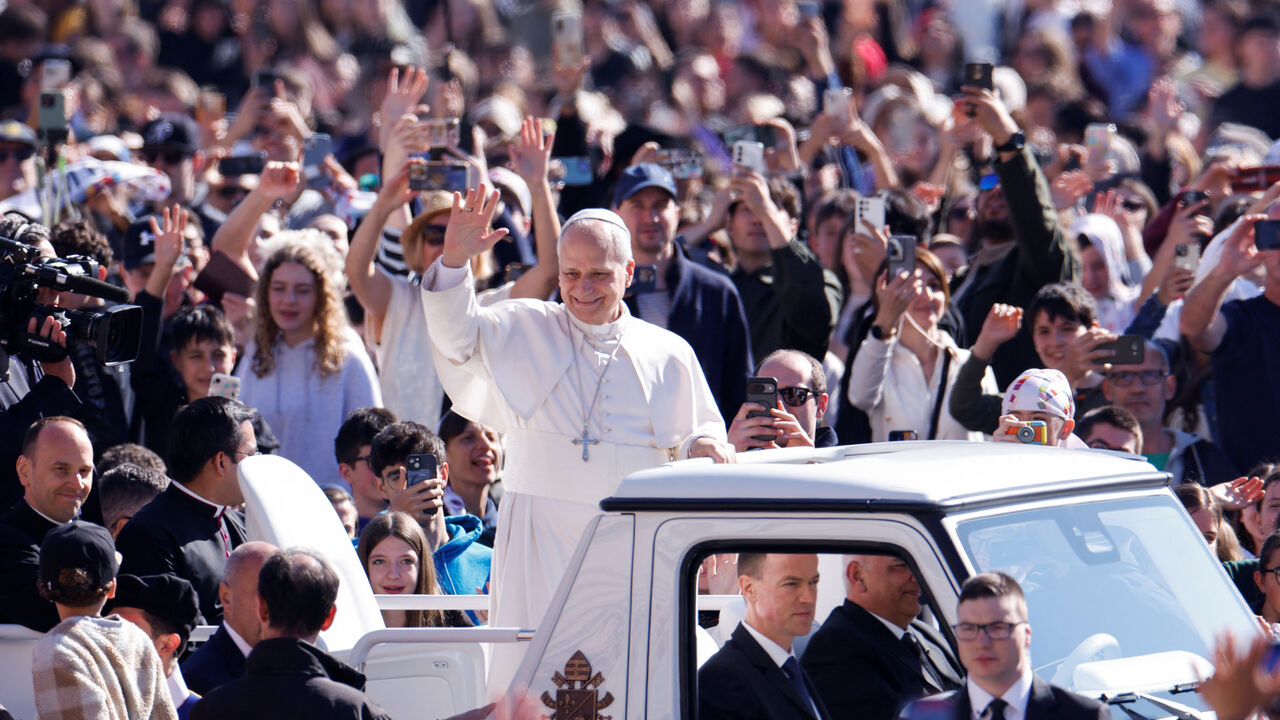 Pope Leo XIV waves on the day he holds the weekly general audience in Saint Peter's Square at the Vatican April 8, 2026. REUTERS/Remo Casilli