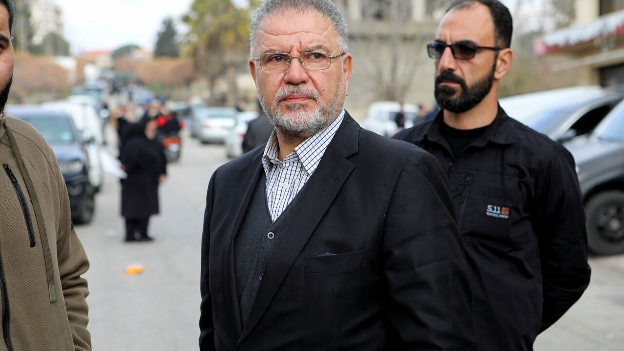 Hezbollah Member of Parliament Ali Fayyad stands in Burj al-Muluk, near the southern Lebanese village of Kfar Kila, where Israeli forces remained on the ground after a deadline for their withdrawal passed as residents sought to return to homes in the border area, Lebanon January 26, 2025. REUTERS/Karamallah Daher