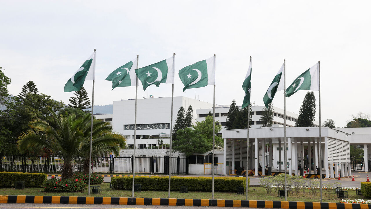 Pakistani flags flutter near the Parliament House, as delegations from the United States and Iran are expected to hold high-stakes talks, in Islamabad, Pakistan, April 11, 2026. REUTERS/Akhtar Soomro