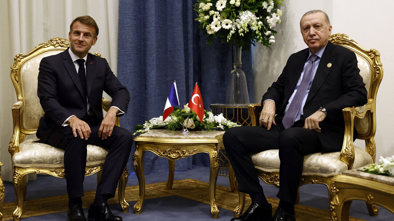 French President Emmanuel Macron meets with Turkey's President Recep Tayyip Erdogan on the day of the Gaza International Peace Summit in Sharm el-Sheikh, Egypt, October 13, 2025. Yoan Valat/Pool via REUTERS