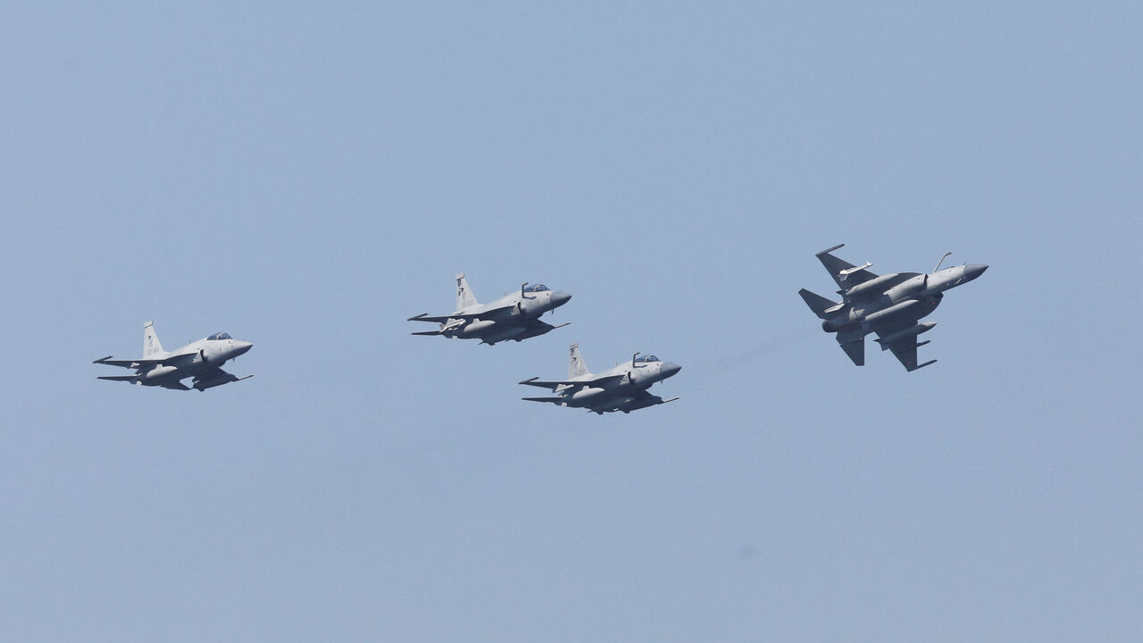 FILE PHOTO: Pakistan Air Force's JF-17 Thunder jets fly past during the sea phase of Pakistan Navy's Multinational Exercise AMAN-23, in the North Arabian Sea near Karachi, Pakistan, February 13, 2023. REUTERS/Akhtar Soomro/File Photo