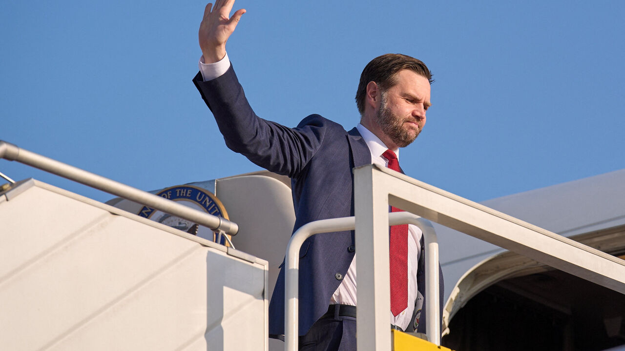 FILE PHOTO: U.S. Vice President JD Vance gestures as he boards Air Force Two, after peace talks with Iran in Islamabad, Pakistan, Sunday, April 12, 2026. Jacquelyn Martin/Pool via REUTERS/File Photo