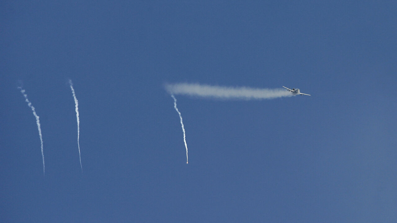 U.S. air force fighter plane A-10 "Warthog" fires shells towards insurgents, as seen from the Combat Outpost Cahill, a small U.S. military camp southeast of Baghdad, November 6, 2007. REUTERS/Erik de Castro/File Photo