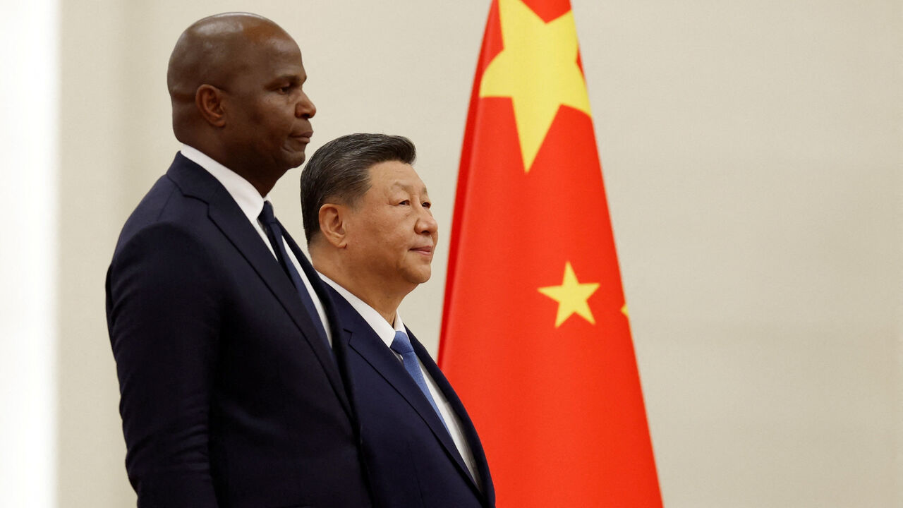 China's President Xi Jinping and Mozambique's President Daniel Chapo attend a welcoming ceremony at the Great Hall of the People in Beijing, China April 21, 2026. Haruna Furuhashi/Pool via REUTERS