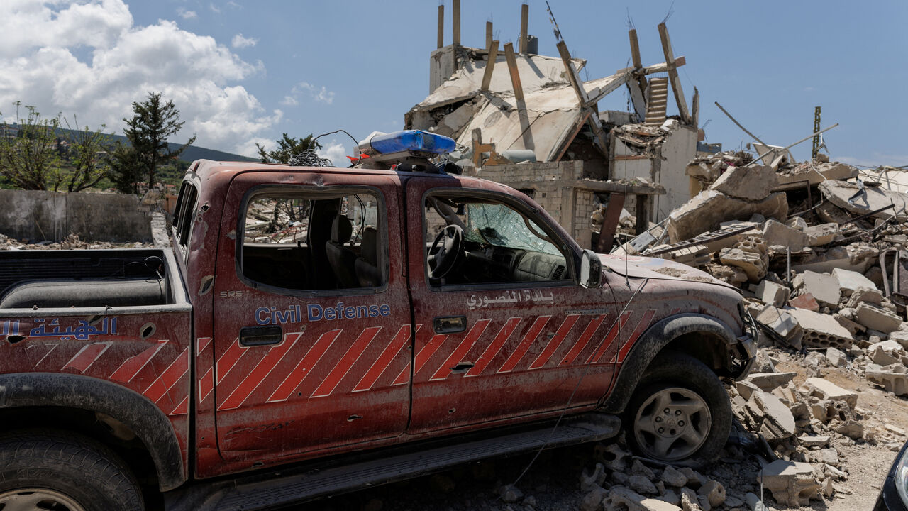 FILE PHOTO: A damaged civil defence car parks in front of a house damaged by an Israeli strike, amid a 10-day ceasefire between Lebanon and Israel, in Mansouri village, southern Lebanon, April 21, 2026. REUTERS/Zohra Bensemra/File Photo