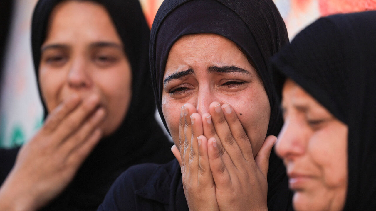 Women mourn during the funeral of Palestinians, who were killed in an Israeli strike, according to medics, at Al-Shifa Hospital in Gaza City, April 23, 2026. REUTERS/Dawoud Abu Alkas