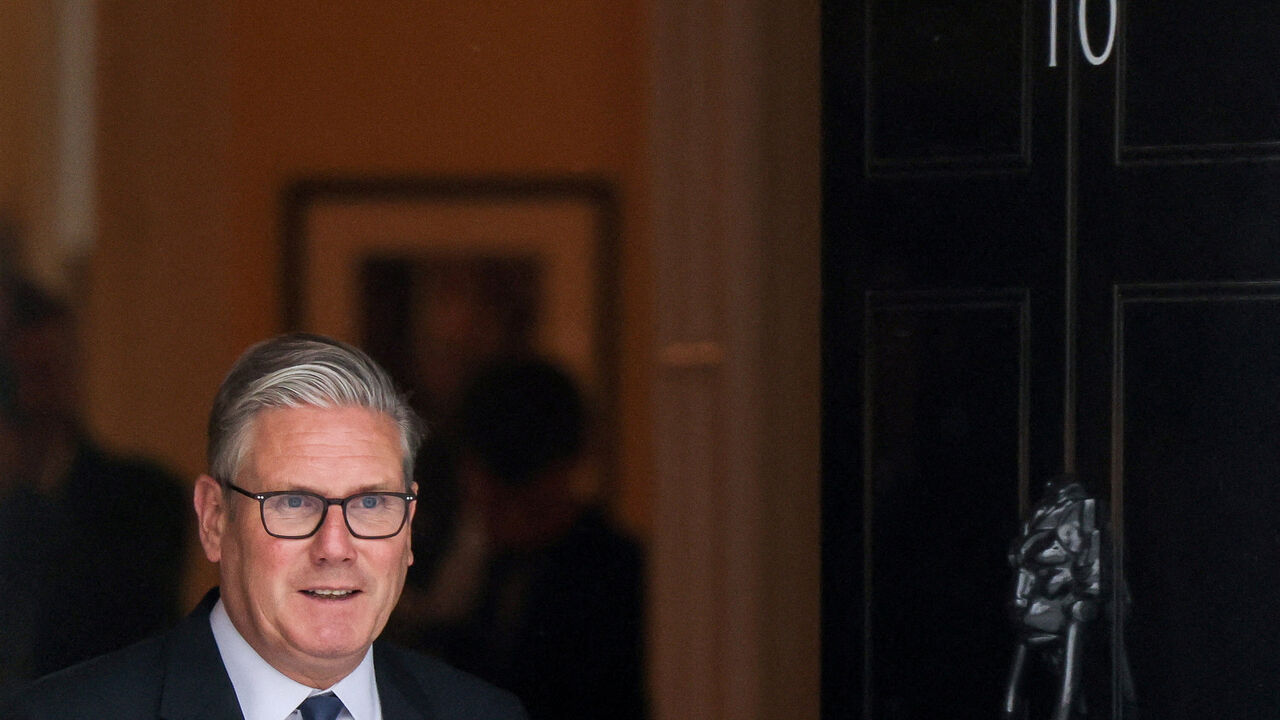 FILE PHOTO: Britain's Prime Minister Keir Starmer steps outside 10 Downing Street in London, Britain, April 22, 2026. REUTERS/Toby Shepheard/File Photo