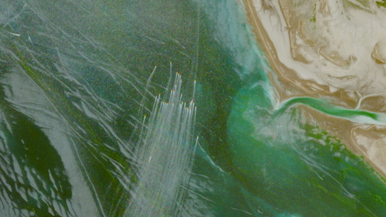 A satellite image shows a fleet of small boats at sea, north of the Strait of Hormuz near the Kargan coast, Iran, April 22, 2026.   European Union/Copernicus Sentinel-2/Handout via REUTERS