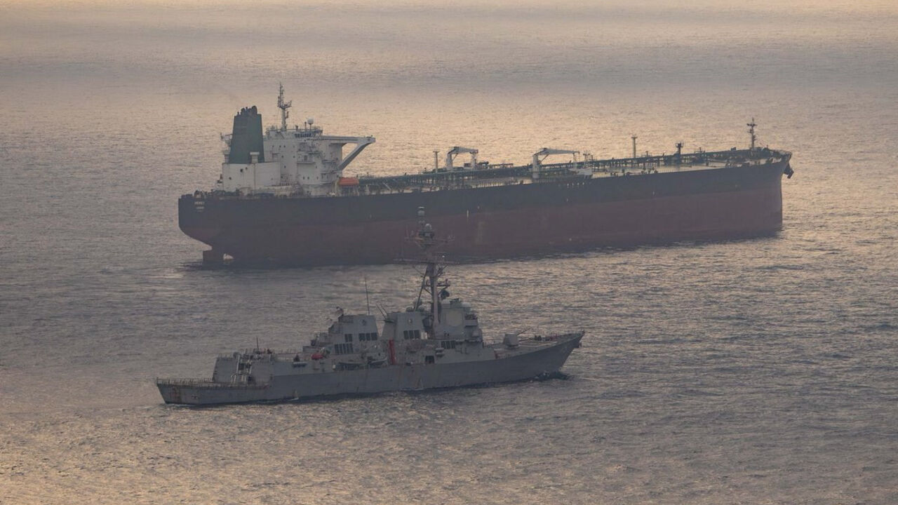 USS Rafael Peralta (DDG 115) near what the U.S. Central Command said was a vessel attempting to sail to an Iranian port, as it enforces the U.S. blockade on Iranian ports, at an unknown location, released April 24, 2026.   U.S. Central Command/Handout via REUTERS
