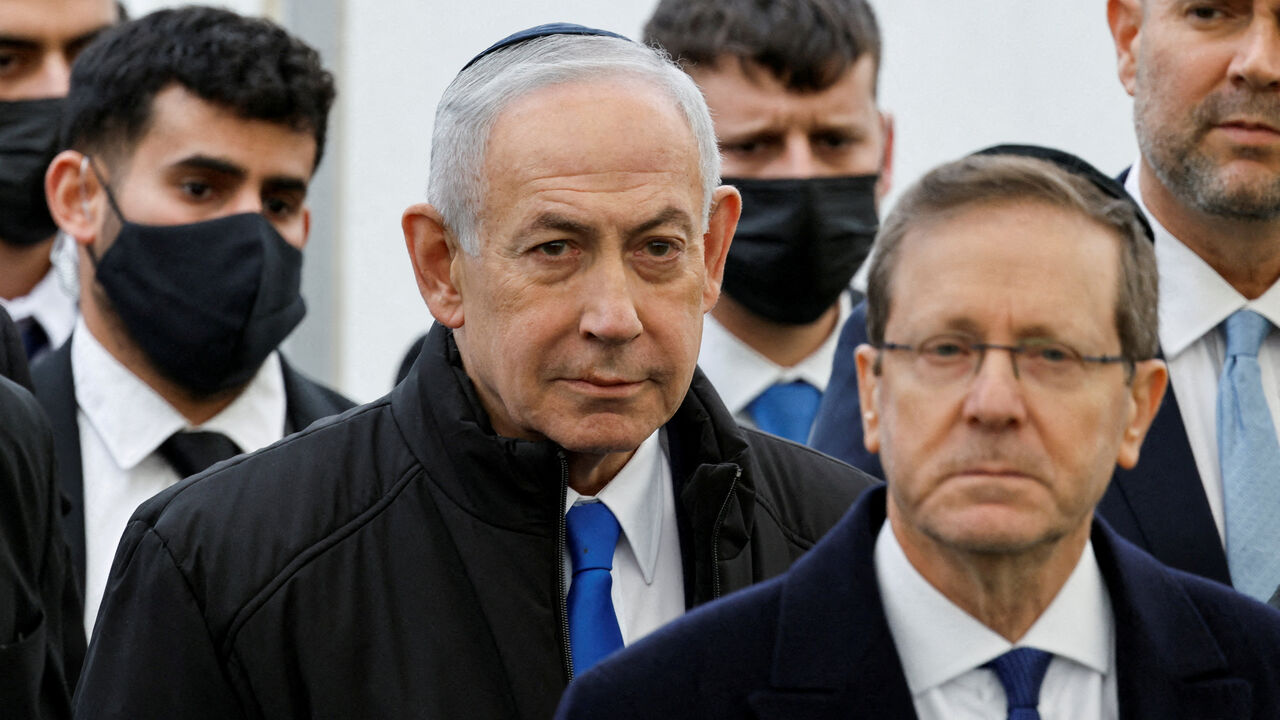 FILE PHOTO: Israeli Prime Minister Benjamin Netanyahu and Israeli President Isaac Herzog attend a memorial service in Meitar, Israel, January 28, 2026. REUTERS/Amir Cohen/File Photo