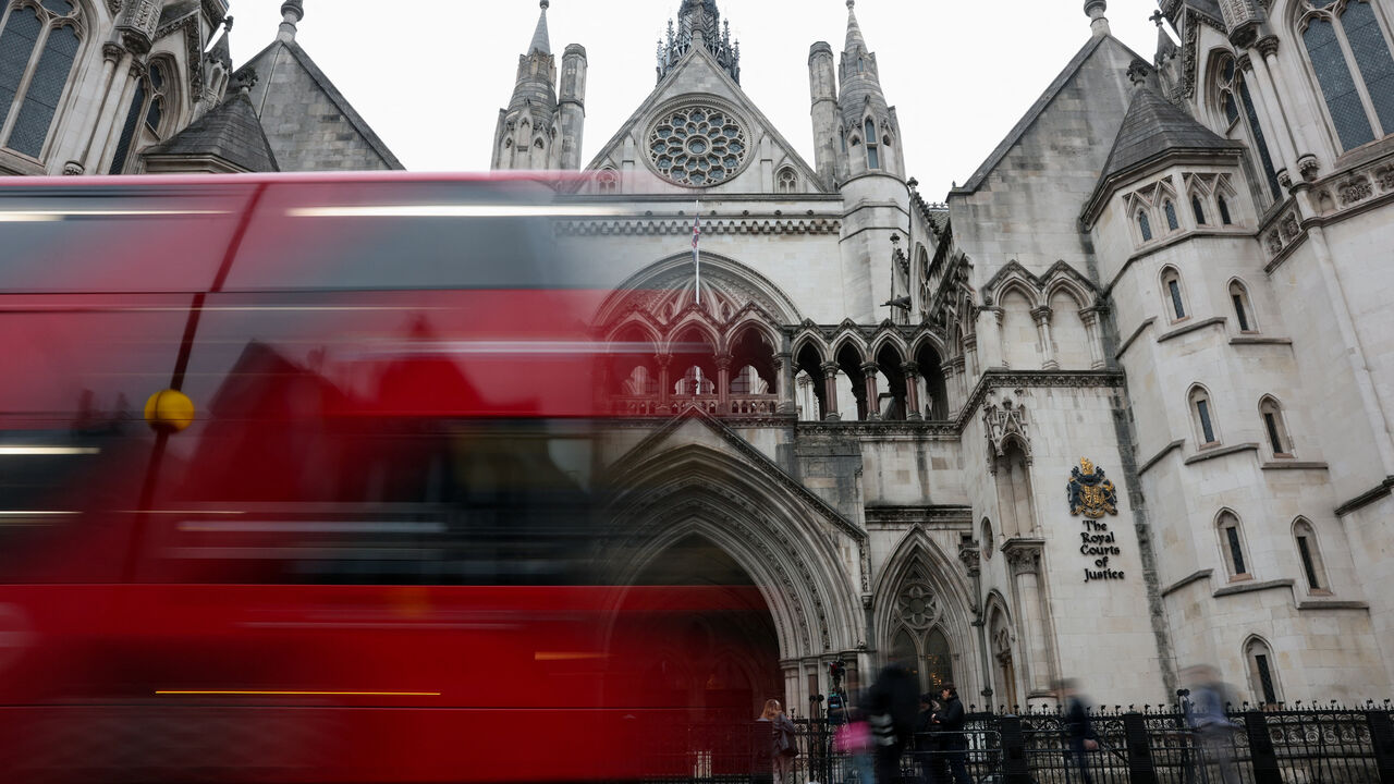 A bus passes by the Royal Courts of Justice, in London, Britain, January 19, 2026. REUTERS/Hannah McKay