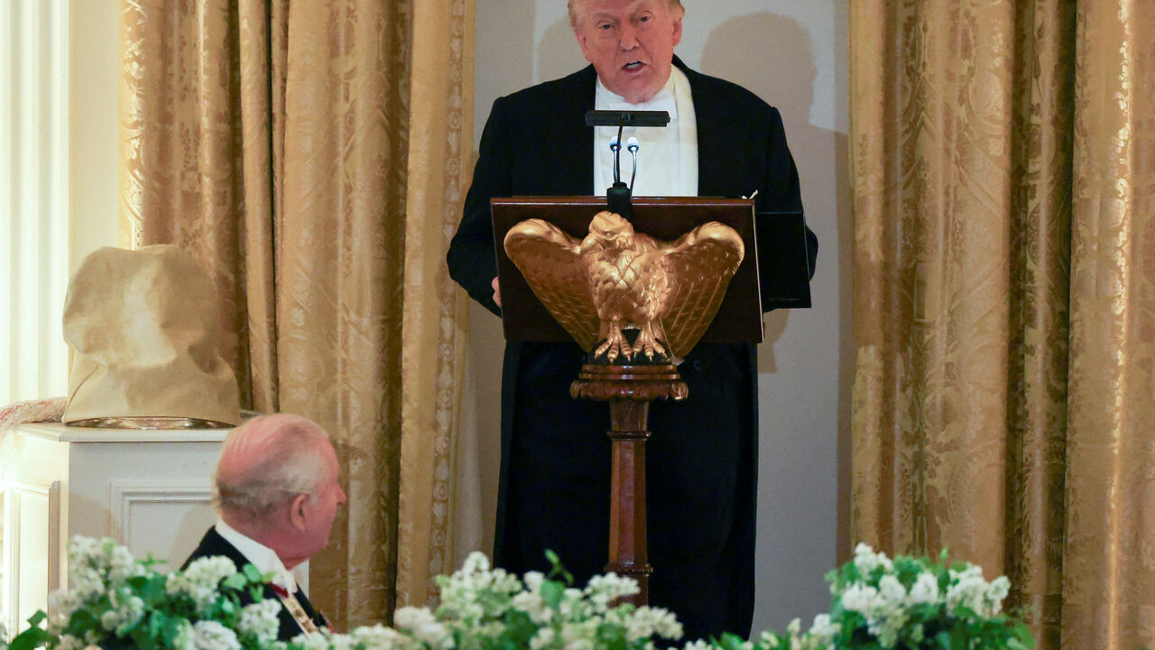 Britain's King Charles listens as U.S. President Donald Trump speaks during a state dinner for the King and Queen Camilla at the White House in Washington, D.C., U.S., April 28, 2026. REUTERS/Suzanne Plunkett