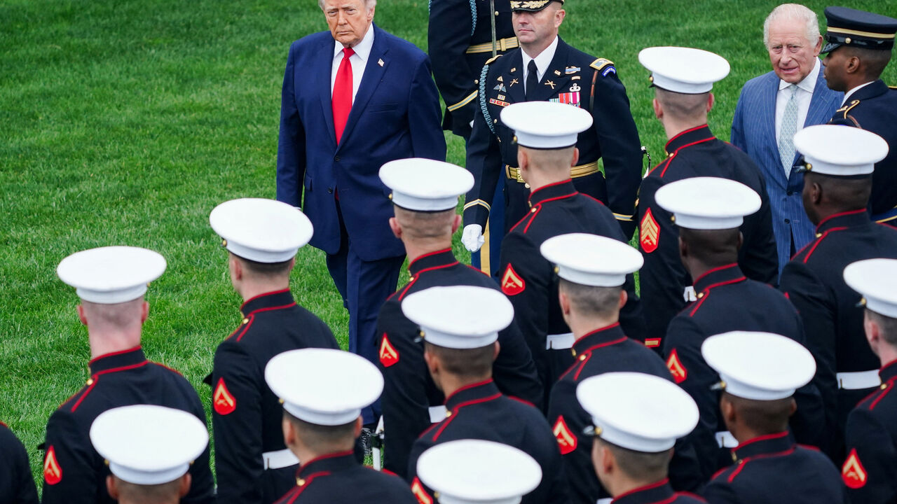 U.S. President Donald Trump and Britain's King Charles review the honour guard during the arrival ceremony for King Charles and Queen Camilla on the South Lawn of the White House in Washington, D.C., U.S., April 28, 2026. REUTERS/Nathan Howard