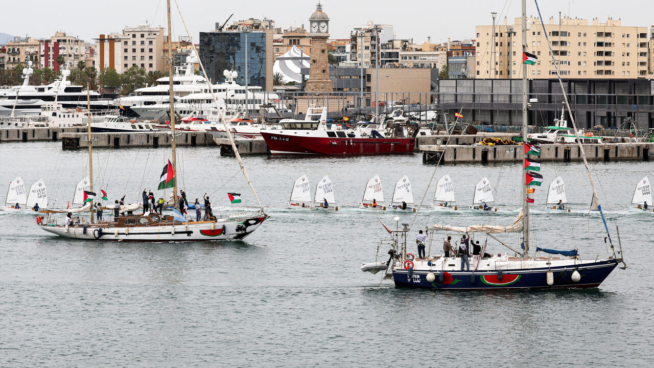 Boats taking part in a humanitarian flotilla depart for Gaza from Barcelona, Spain, April 12, 2026. REUTERS/Nacho Doce