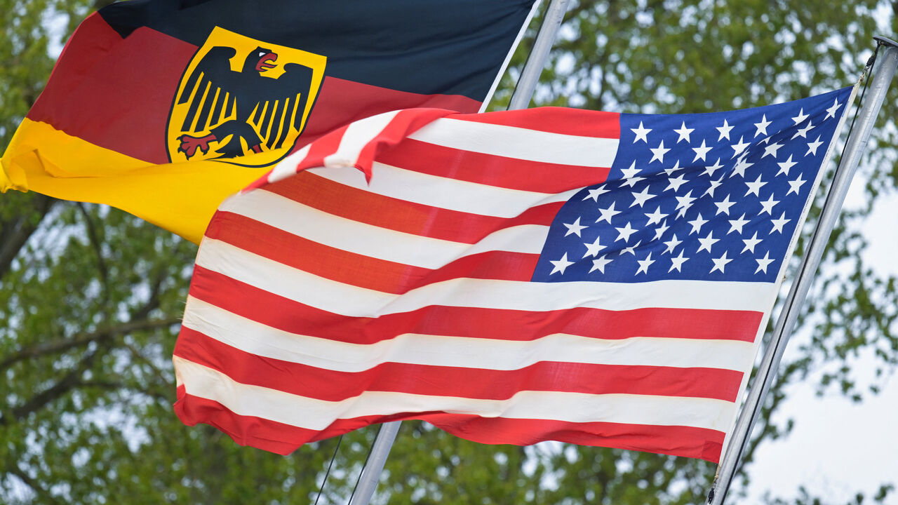 The German flag featuring the Federal Eagle and the U.S. flag are pictured at the German Navy base in Kiel, Germany, April 23, 2026. REUTERS/Fabian Bimmer