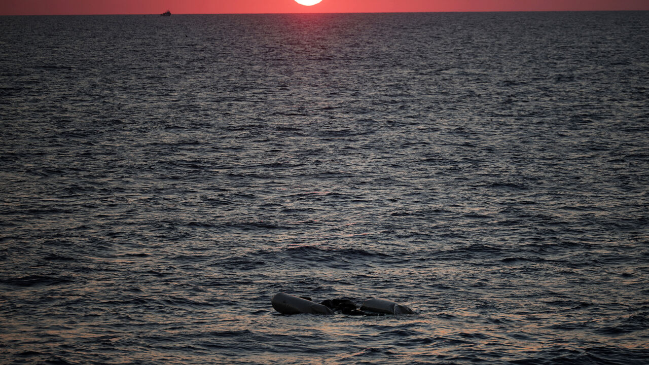 FILE PHOTO: A rubber boat used by migrants floats at the sea on sunset in the Mediterranean, off Libya, August 9, 2025. REUTERS/Louisa Gouliamaki/File Photo