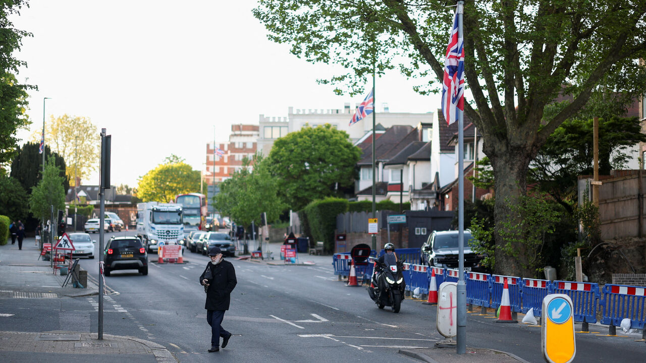 A man walks near the scene where a man was arrested on Wednesday following a stabbing incident in which two Jewish men were wounded in the Golders Green area, which is home to a large Jewish population, in London, Britain, April 30, 2026. REUTERS/Hannah McKay