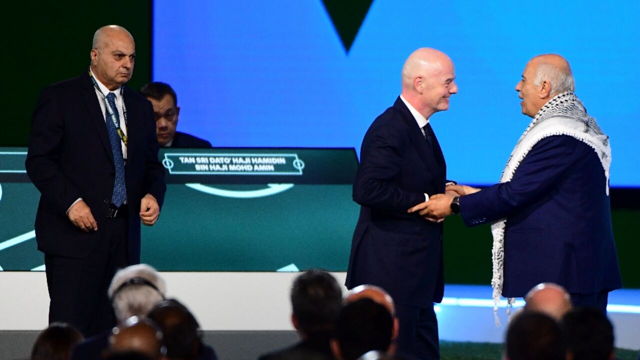 FIFA President Gianni Infantino invited President of the Palestine Football Association Jibril Rajoub and Vice-President of Israel Football Association Basim Sheikh Suliman to stand alongside him, but Rajoub declined