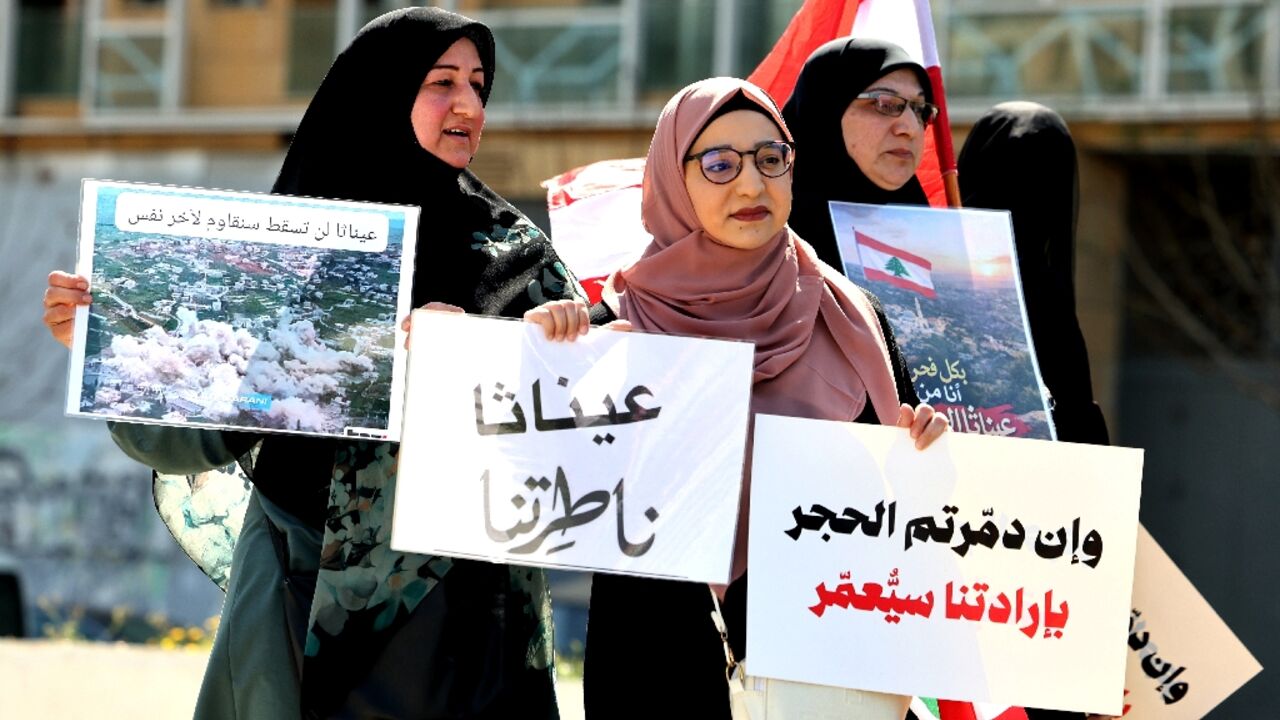 Residents and inhabitants of the devastated southern Lebanese border villages protest against the destruction of their villages