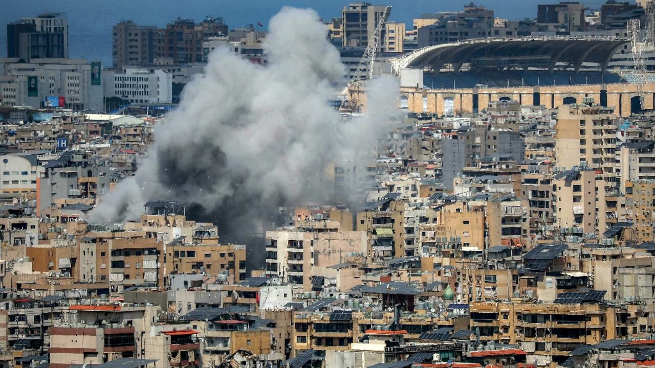 Smoke rises from the site of an Israeli strike in Beirut's southern suburbs, near Camille Chamoun Sports City stadium