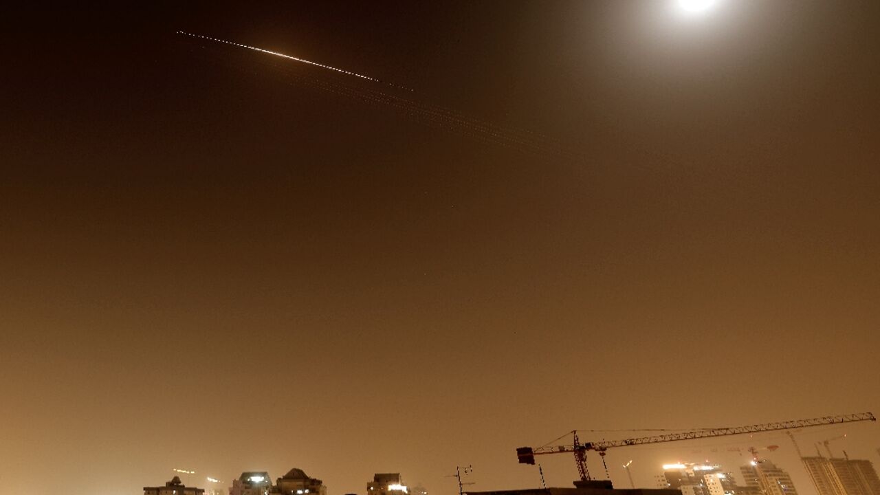 Rocket trails are seen in the sky above the Netanya, Israel, on April 4, 2026.