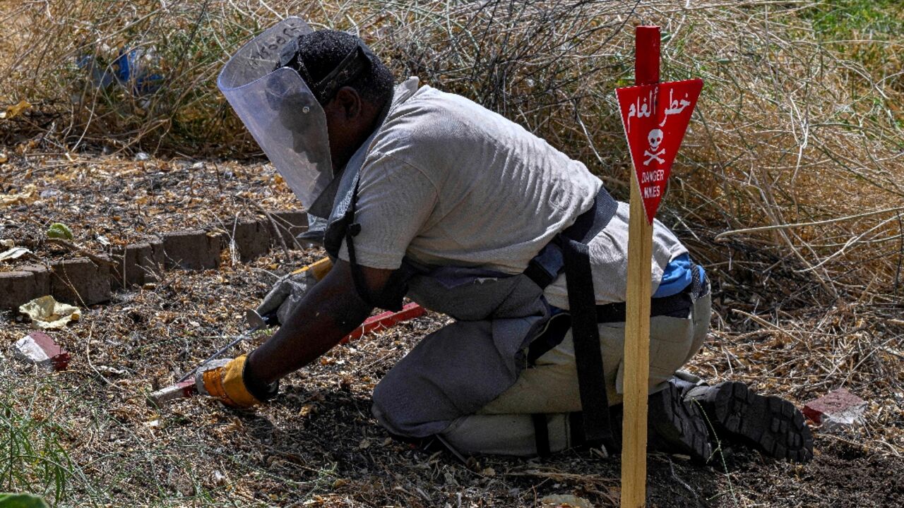 Anti-mine teams have cleared thousands of explosives from around Sudan's capital