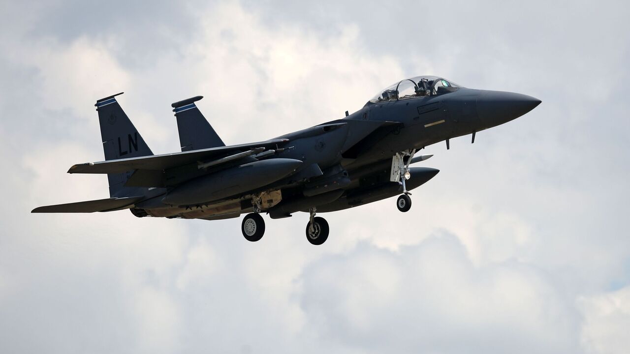 A US Air Force (USAF) F-15E Eagle fighter jet, is pictured as it prepares to land at RAF (Royal Air Force) Lakenheath, east of England, on June 15, 2020. - The UK Coastguard launched a search and rescue operation Monday to find the pilot of a US fighter jet that crashed during a training mission in the North Sea. The US Air Force said the F-15C Eagle went down after taking off from the RAF Lakenheath base near the town of Mildenhall in eastern England. The base is home to the 48th Fighter Wing, which has op
