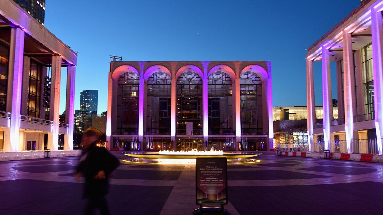A person walks past the closed Metropolitan Opera at Lincoln Center on Jan. 7, 2021, in New York City.