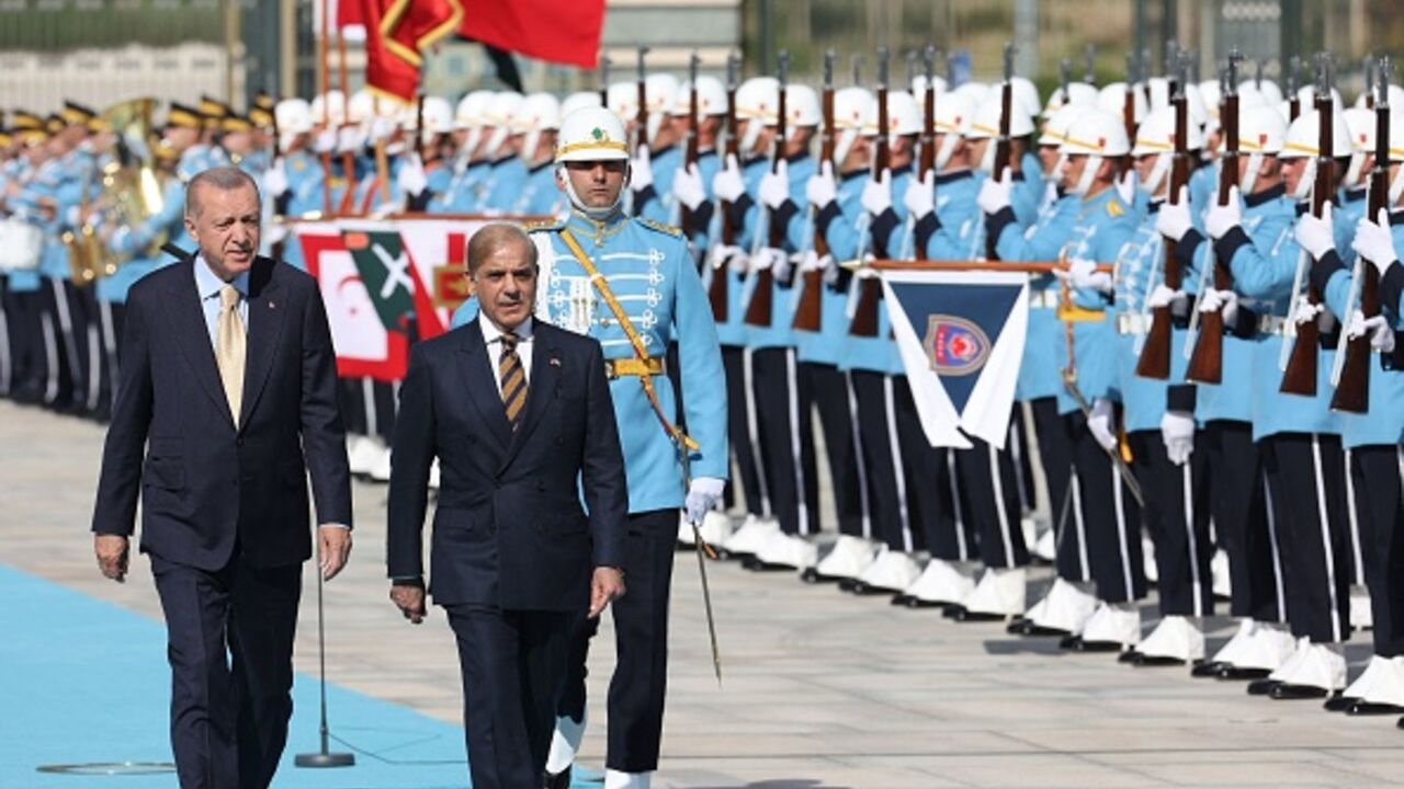 Turkish President Recep Tayyip Erdogan (L) walks with Prime Minister of Pakistan Shehbaz Sharif upon his arrival during an official ceremony at the Presidential Complex in Ankara, Turkey on June 1, 2022. (Photo by Adem ALTAN / AFP) (Photo by ADEM ALTAN/AFP via Getty Images)