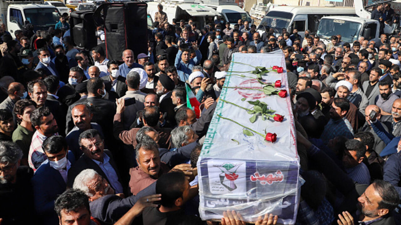 Iranians carry the coffin of one of the people killed in a shooting attack, during their funeral in the city of Izeh in Iran's Khuzestan province, on November 18, 2022. In some of the worst violence since the protests erupted, assailants on motorbikes shot dead seven people, including a woman and two children aged nine and 13, at a central market of Izeh on the evening of November 16, 2022, state media said. (Photo by ALIREZA MOHAMMADI / isna / AFP) (Photo by ALIREZA MOHAMMADI/isna/AFP via Getty Images)