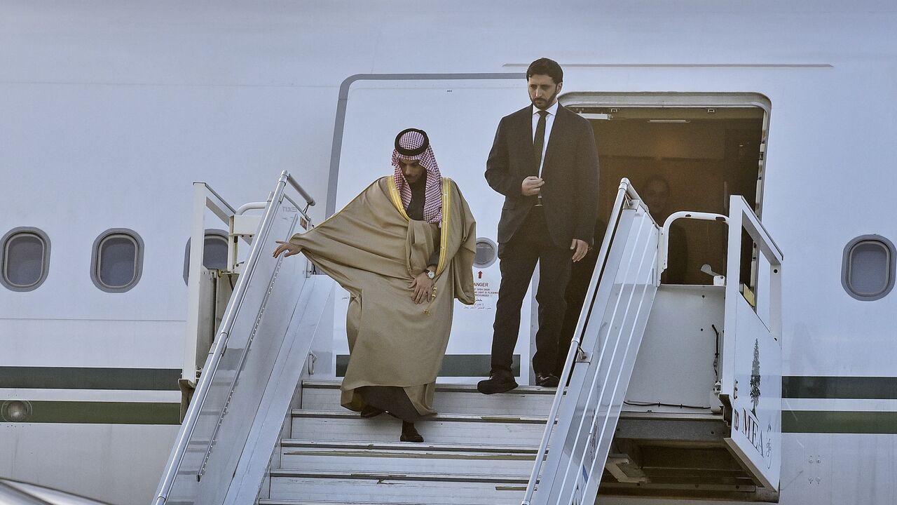 Saudi Arabia's Foreign Minister Faisal bin Farhan (L) disembarks from an airplane upon his arrival at the Rafic Hariri International Airport in Beirut on Jan. 23, 2025. 