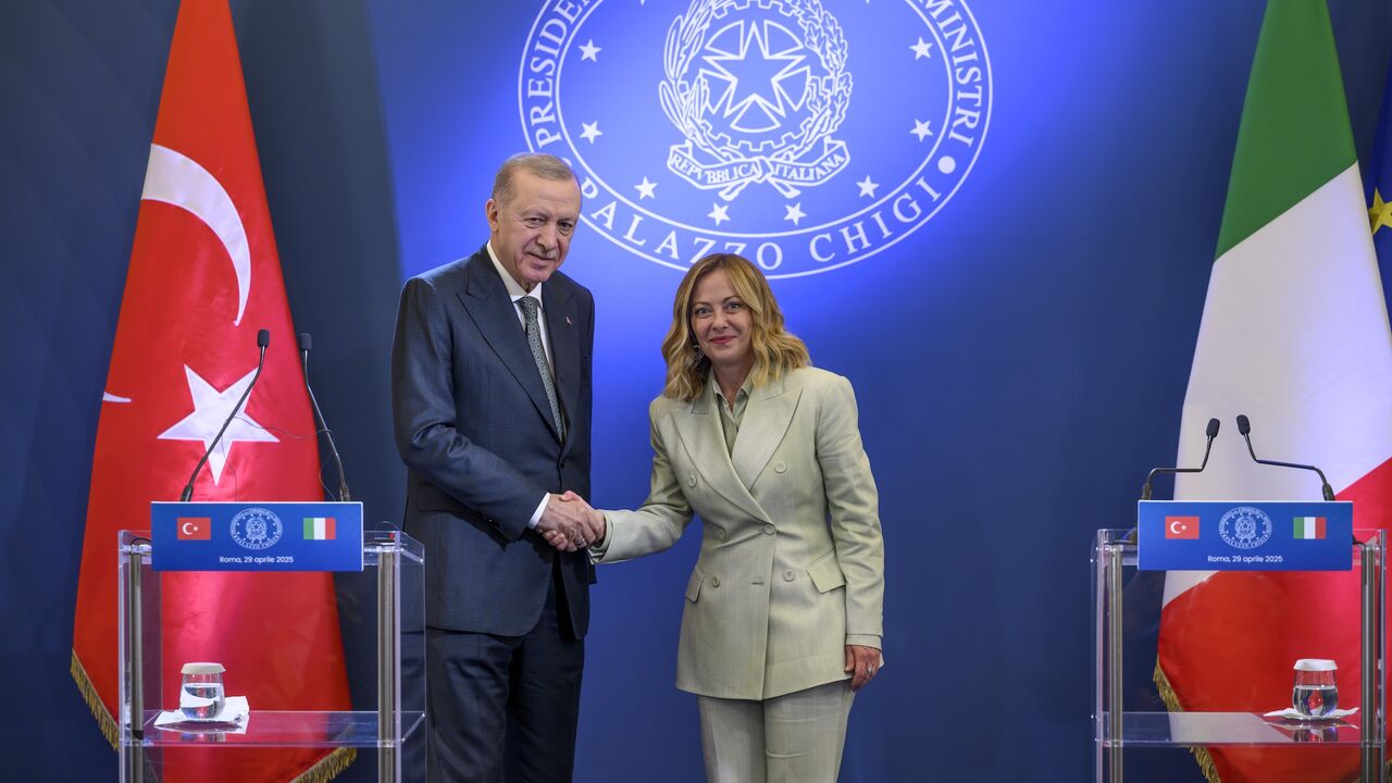 Turkish President Recep Tayyip Erdogan and Italian Prime Minister Giorgia Meloni shake hands during the press conference following their meeting at Villa Doria Pamphilj, on April 29, 2025, in Rome, Italy.