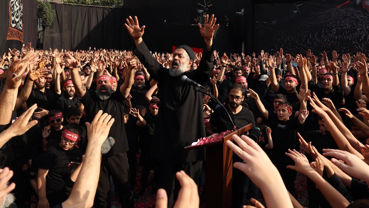 Mahmoud Karimi, a maddah, leads a mourning ritual during the Muslim month of Muharram in the lead-up to Ashura, a 10-day period commemorating the seventh century killing of Prophet Mohammed's grandson Imam Hussein in Tehran on July 3, 2025.