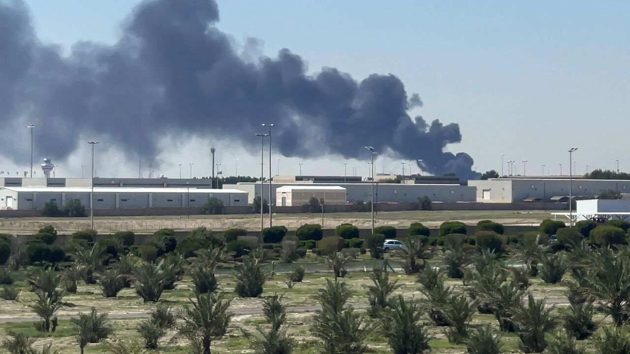 Smoke rises from an area of Kuwait's international airport after a reported drone strike on April 1, 2026. Kuwait's civil aviation authority said that the Gulf state's international airport had come under an Iranian drone attack that led to "a large fire" at a fuel depot. (Photo by AFP via Getty Images) / Kuwait OUT / KUWAIT OUT