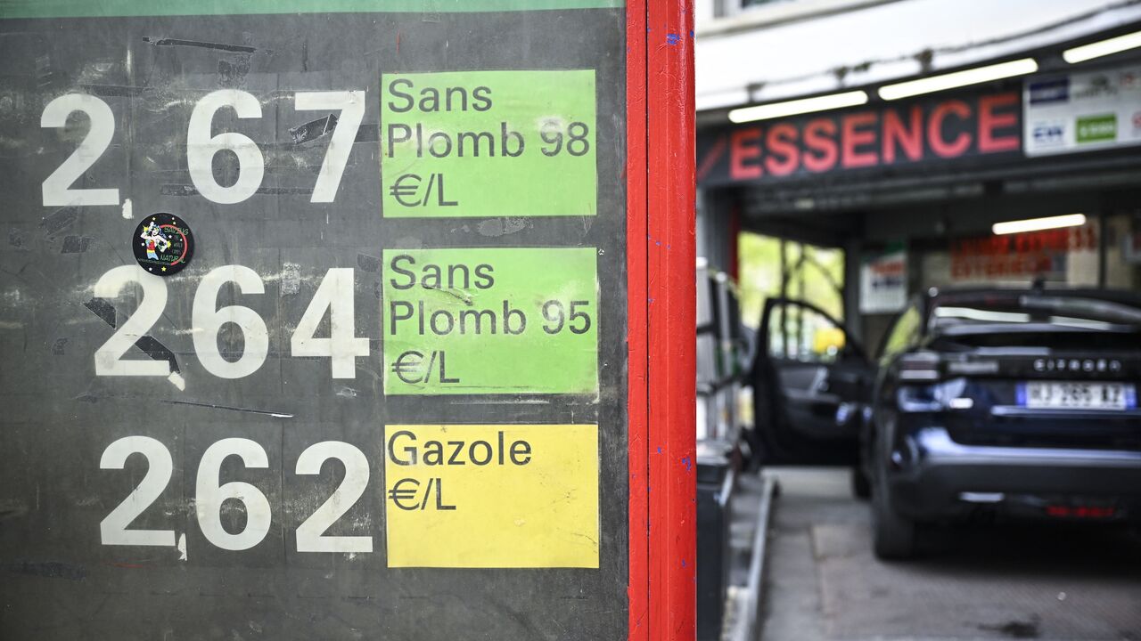 This photograph shows a sign displaying the daily price panel for SP98, SP95 and diesel at a gas station in Paris on April 2, 2026. 