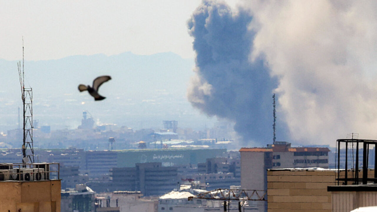 Smoke rises following strikes on Tehran on April 7, 2026. New strikes rocked Tehran on April 7 with Iran showing no sign of backing down as a US deadline loomed for it to reopen the Strait of Hormuz or have its civilian infrastructure "decimated", according to the US president. (Photo by ATTA KENARE / AFP via Getty Images) /