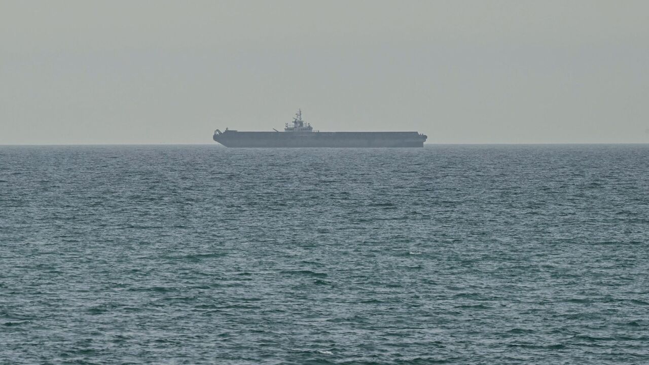 A ship is seen off the coast of Ras al-Khaimah, the day after the failure of US-Iran peace talks on April 13, 2026. The failure of US-Iran peace talks has left the US president with several unpalatable options, as analysts say his order to blockade the strategic Strait of Hormuz could further complicate his next move on April 12, 2026. Any hopes that the US vice president would emerge from the marathon day of negotiations with top Iranian officials with a deal to end a war that has rippled across the Middle