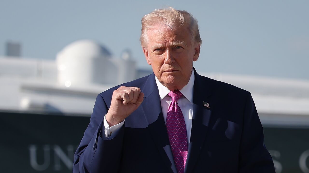 President Donald Trump walks toward reporters before answering questions before boarding Air Force One on April 10, 2026, at Joint Base Andrews, Maryland.
