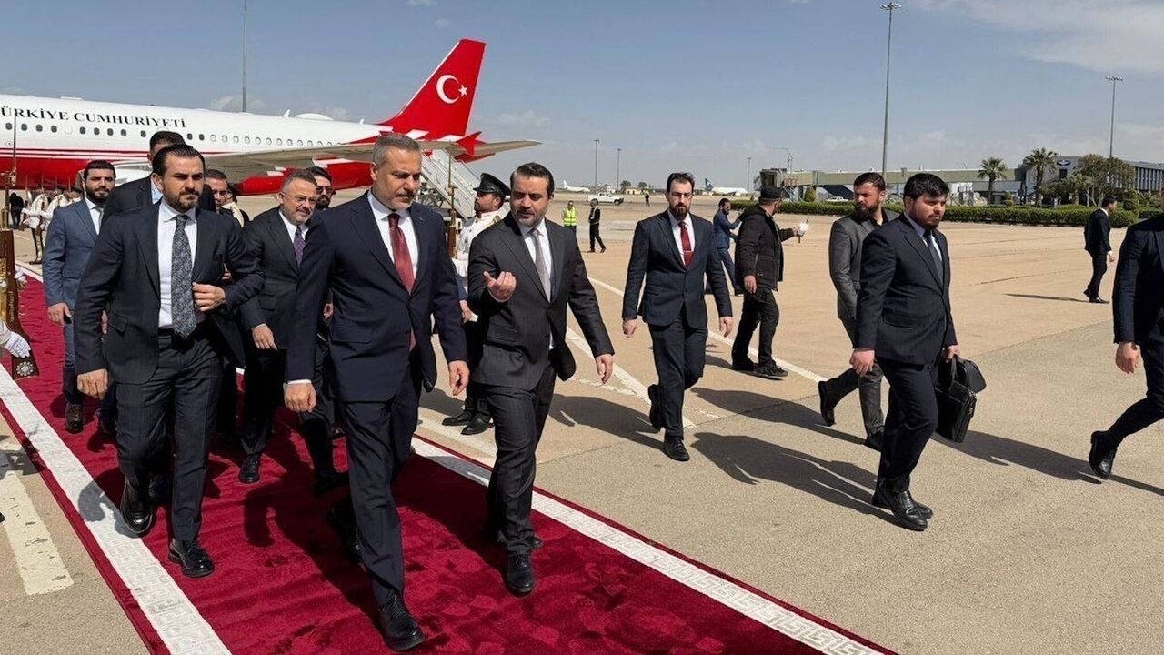 Turkish Foreign Minister Hakan Fidan walks alongside his Syrian counterpart, Asaad Shibani, as he arrives in Damascus, April 5, 2026.
