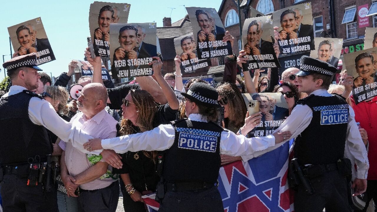 Protesters shouted 'Starmer is a coward' and 'show your face!'