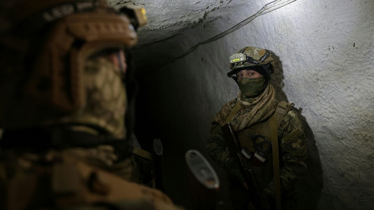 Syrian soldiers inspect a tunnel on the Lebanon border in the Qusayr area