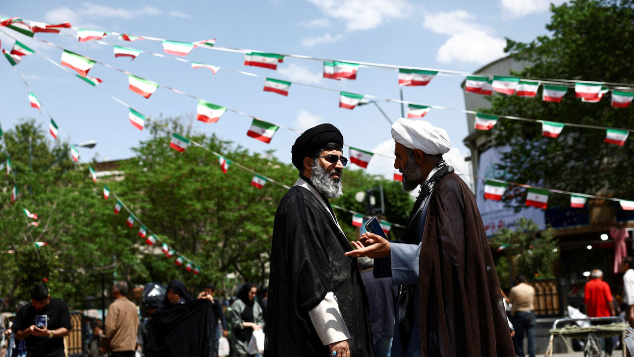 Iranian clerics speak in Tehran Bazaar, amid a ceasefire between U.S. and Iran, in Tehran, Iran, April 21, 2026. Majid Asgaripour/WANA (West Asia News Agency) via REUTERS