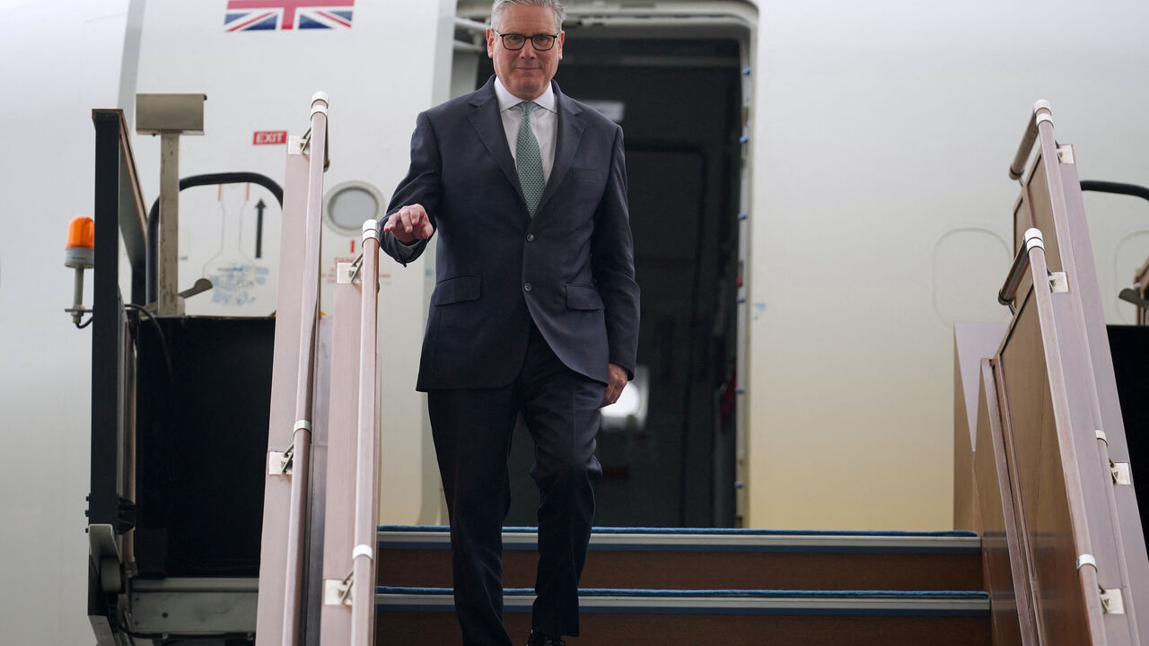 Britain's Prime Minister Keir Starmer deboards the airplane as he arrives at the airport in Abu Dhabi, United Arab Emirates, Thursday, April 9, 2026.    Alastair Grant/Pool via REUTERS