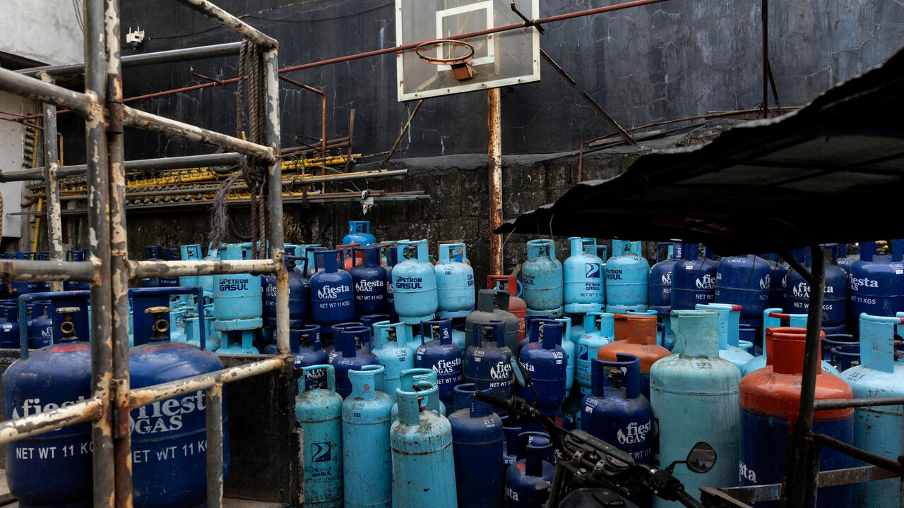 FILE PHOTO: Tanks of liquefied petroleum gas (LPG) are stocked at a store amid rising fuel prices due to disruptions caused by the Iran war, in Manila, Philippines, April 15, 2026. REUTERS/Eloisa Lopez/File Photo