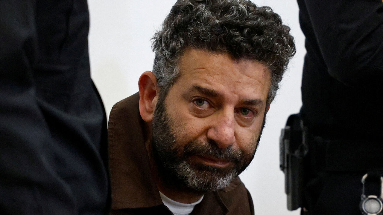 FILE PHOTO: Activist Saif Abu Keshek, a Spanish national, who was detained aboard the Gaza-bound Global Sumud Flotilla, which was intercepted by Israeli forces in international waters, appears at a court in Beersheba, southern Israel May 6, 2026. REUTERS/Amir Cohen/File Photo